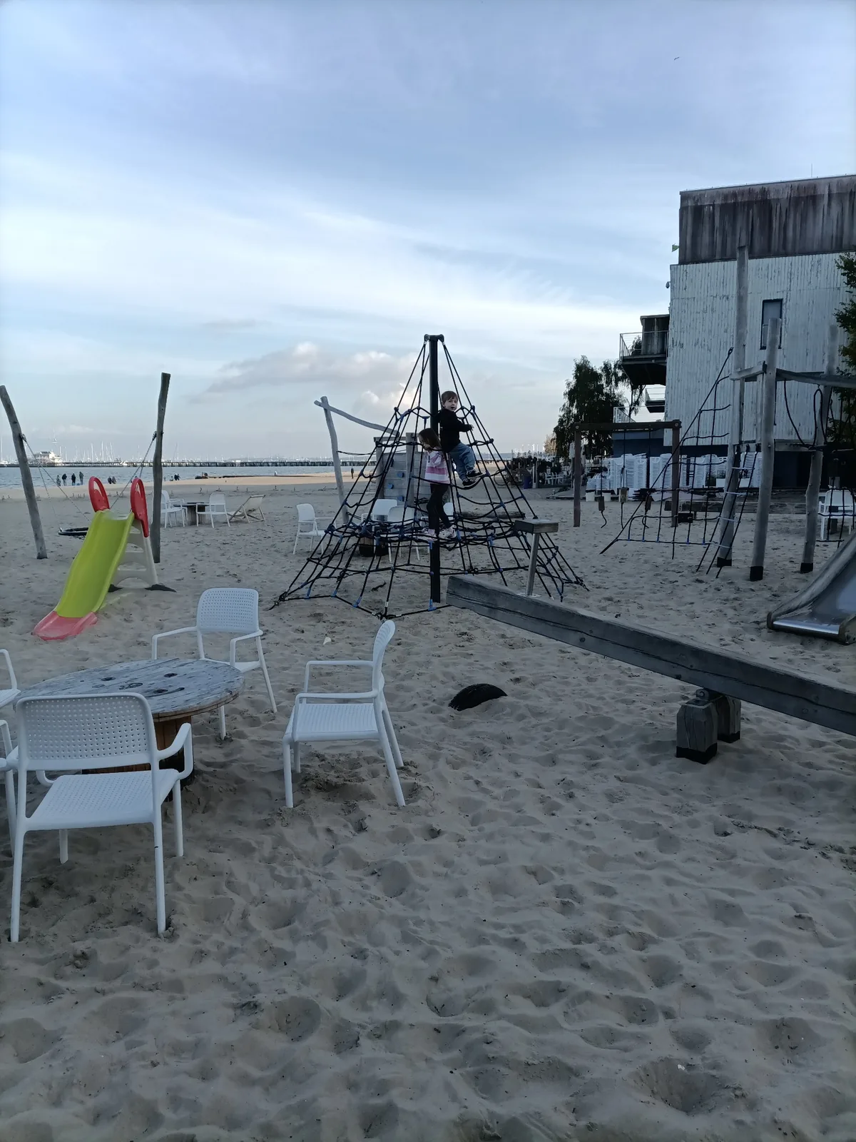 Children climbing at the playground beside Centrala Rybna in Sopot