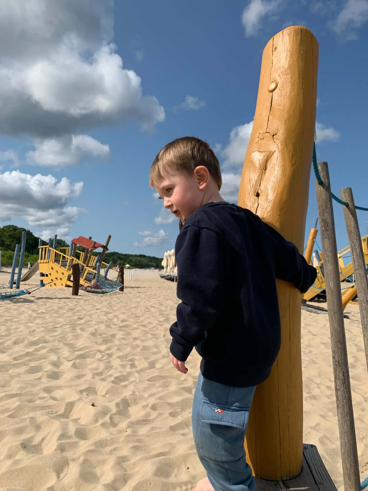 Child at the M15 beach playground in Sopot during our family visit